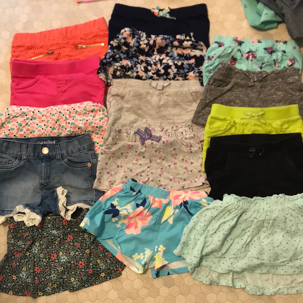 13 pairs of shorts and 2 skirts with shorts underneath. Size 2T